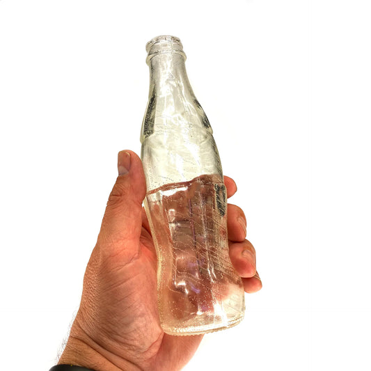 ,,PropBreak" Coca-Cola dūžtantis butelis